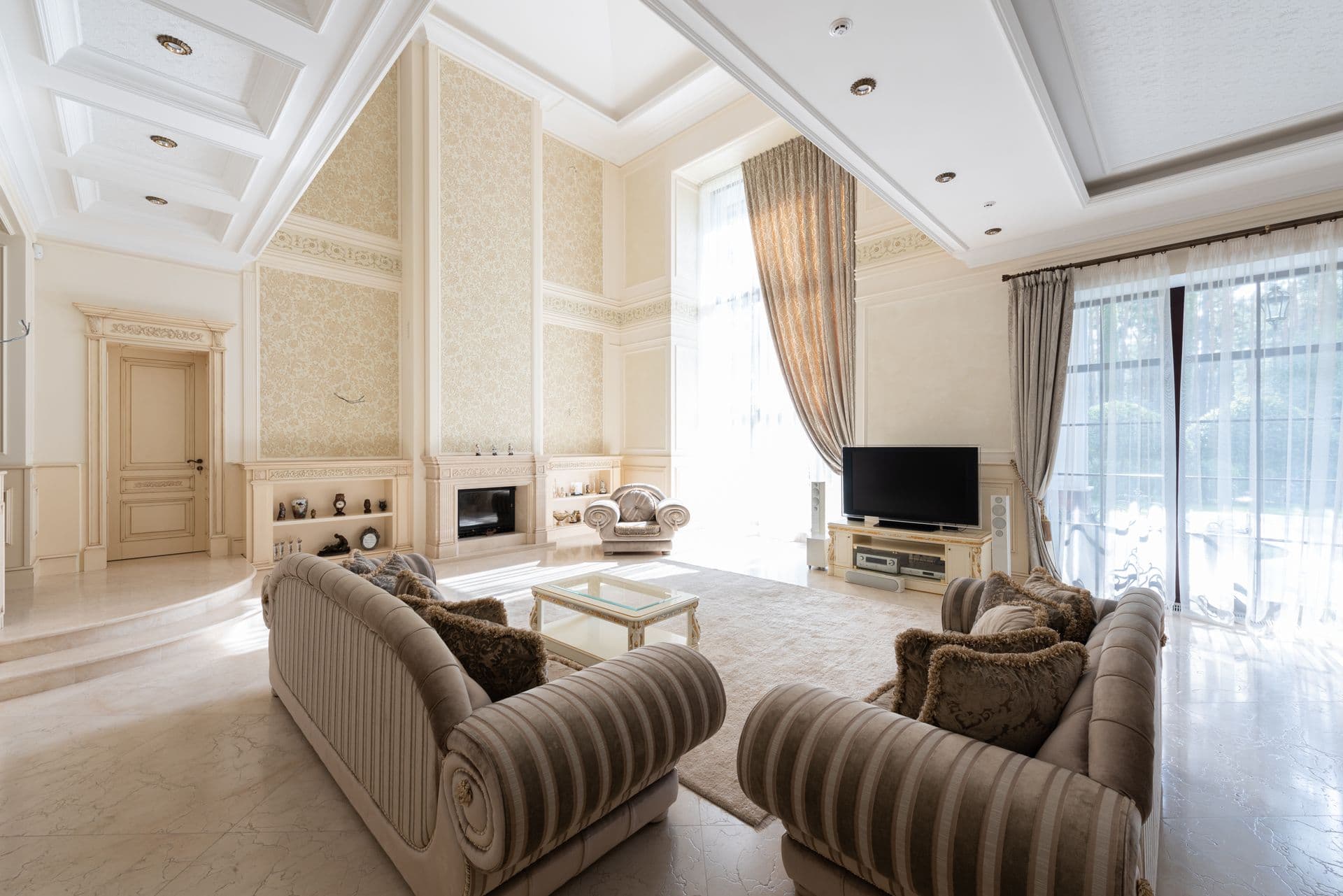 Bright, professionally cleaned interior with a fireplace and large windows